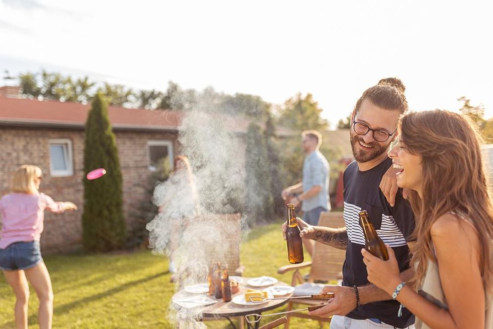 Coworkers at an office BBQ in the summer