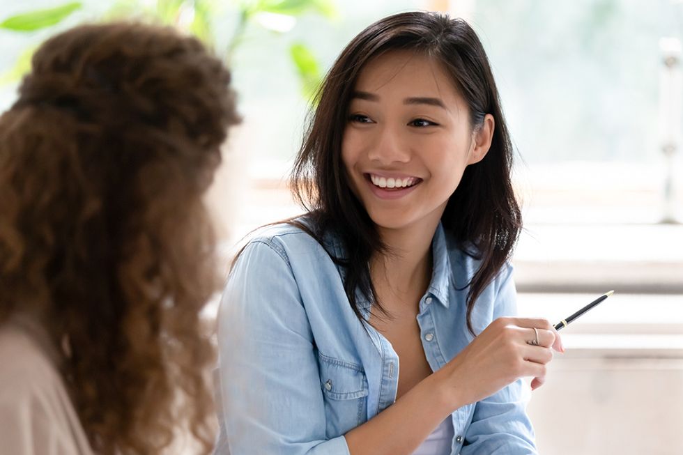 Woman talks to a colleague about time management