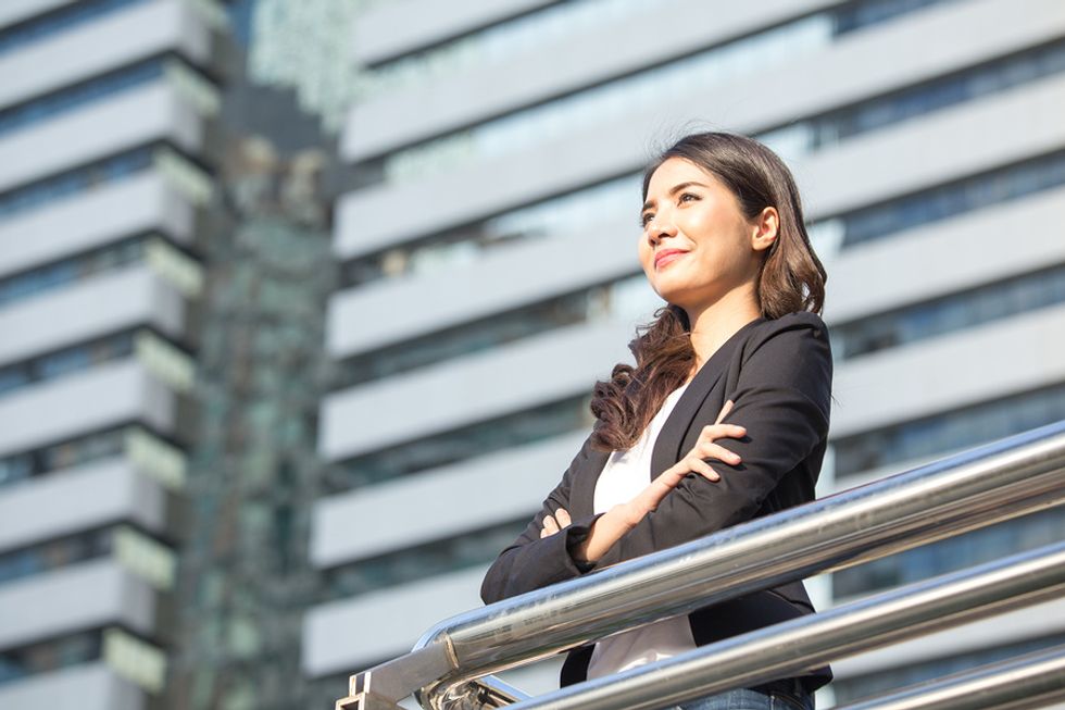 Professional woman thinking about what she wants to achieve in her career