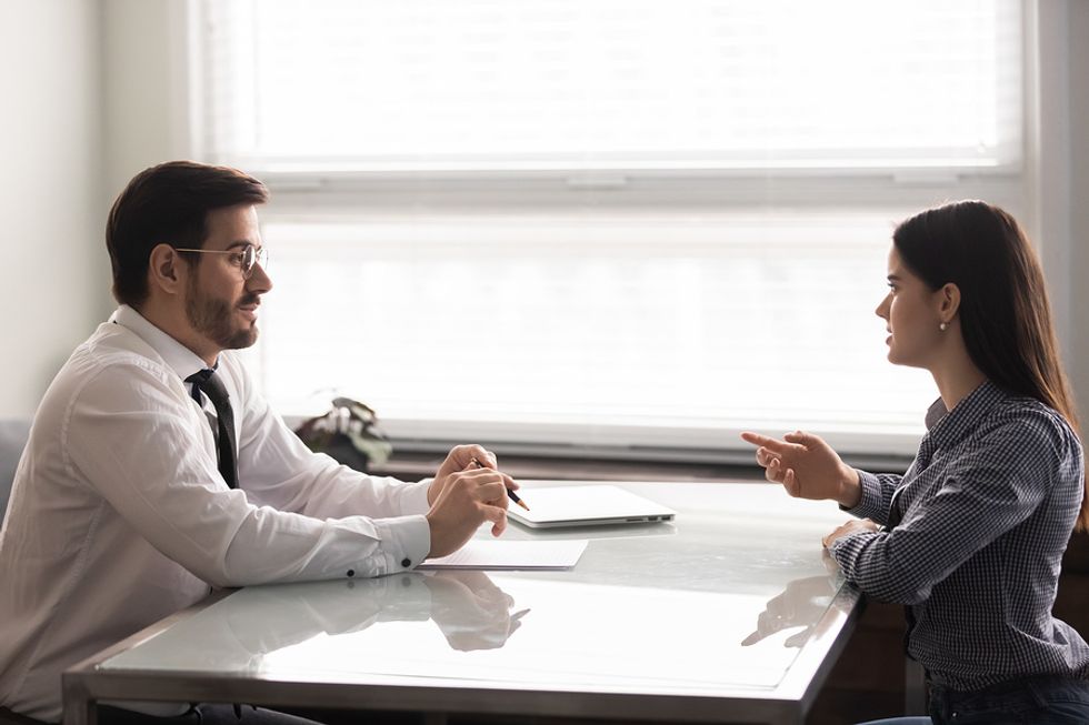 Woman prepares for the interview process with a mock interview