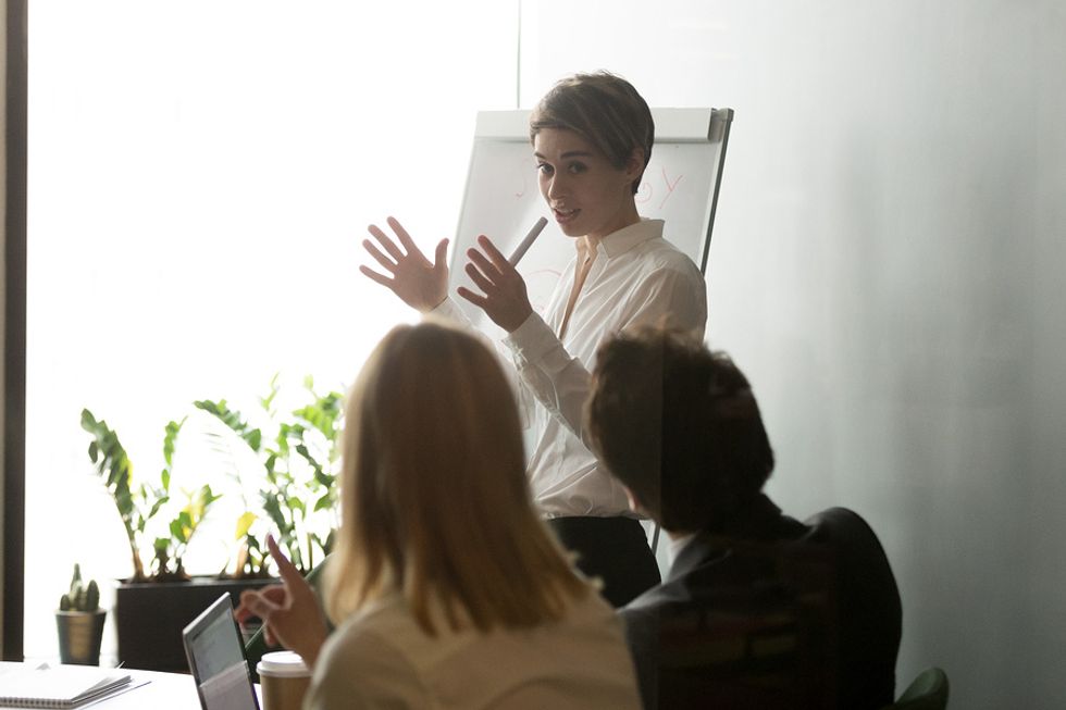 Female boss uses her leadership skills during a work meeting