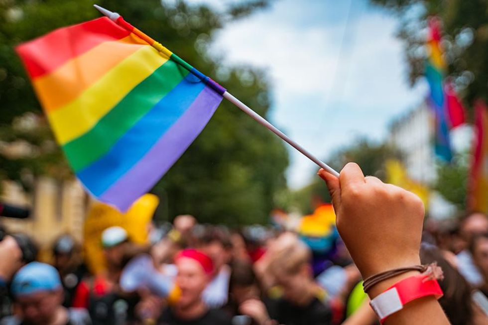 Employees attend a Gay Pride Parade during Pride Month