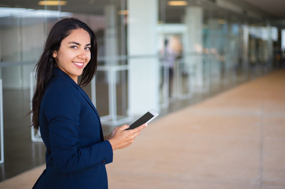 Professional woman at work builds positive habits for career success