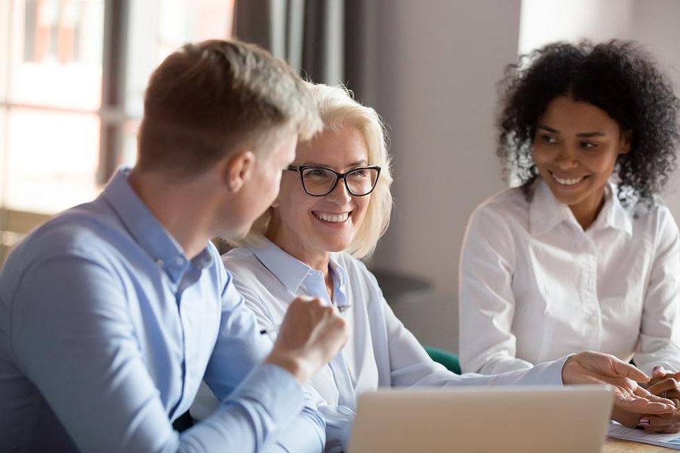 Executive thinks about her executive presence while communicating during a meeting