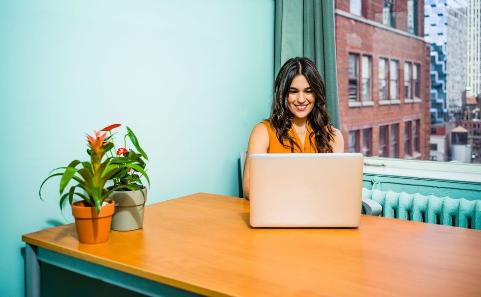 Professional woman on laptop makes an interview bucket list