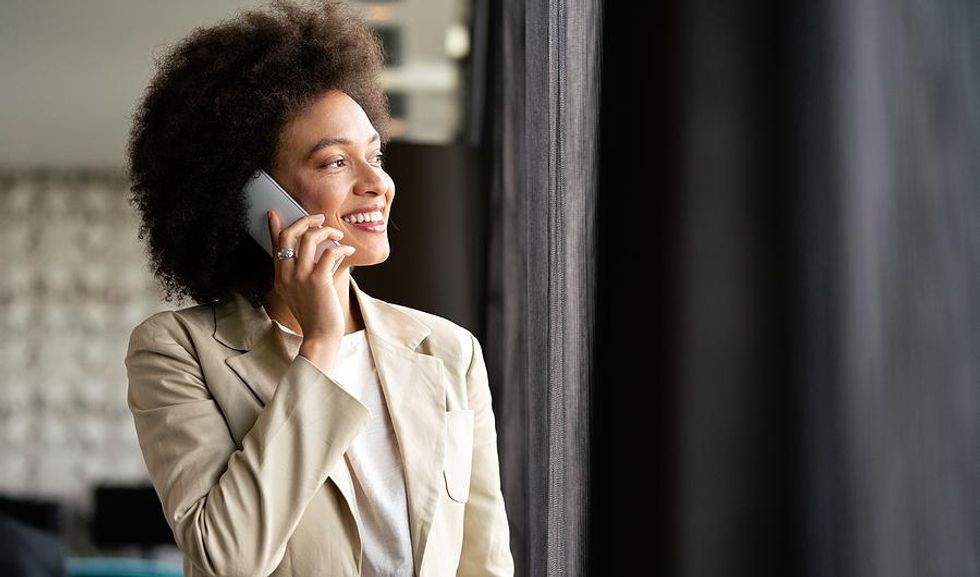 Woman smiles during a phone interview