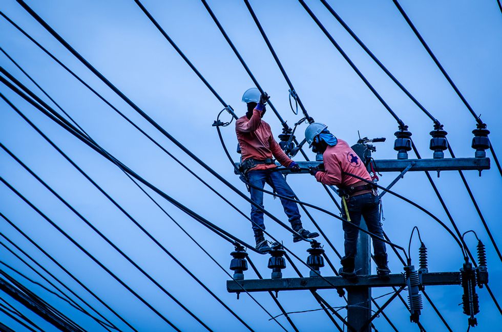 Two tradesmen being active on the job