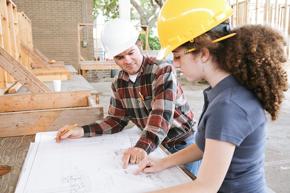 Woman at apprenticeship to learn a trade