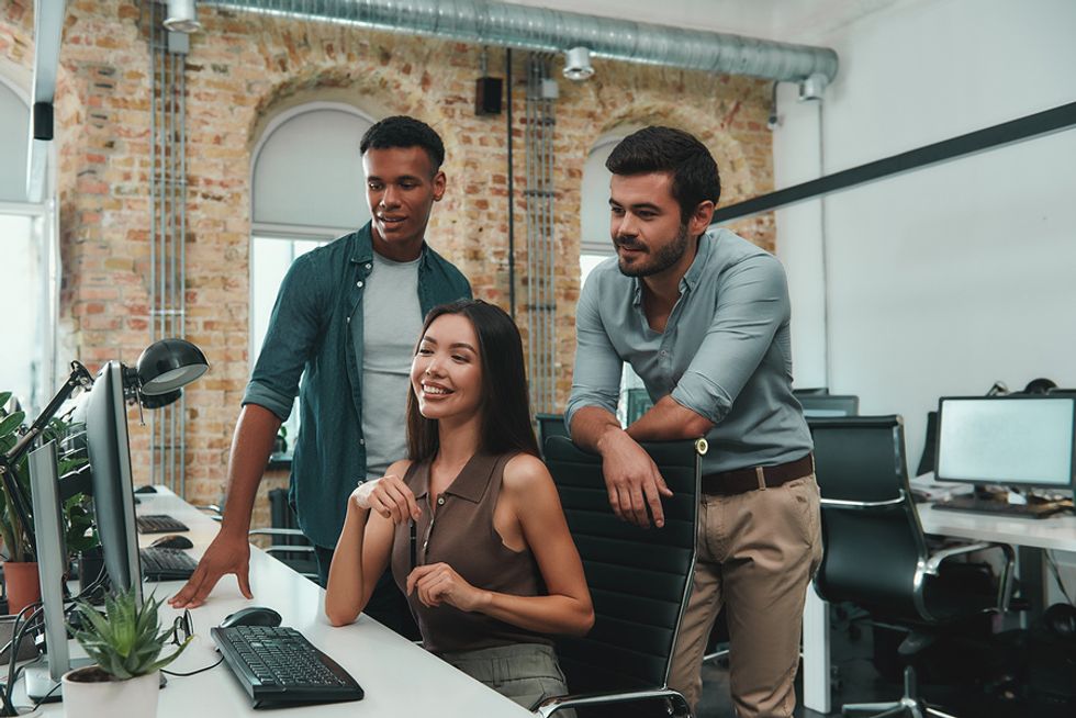 Young professional woman taking a risk by taking on a new project at work and gaining confidence because of it