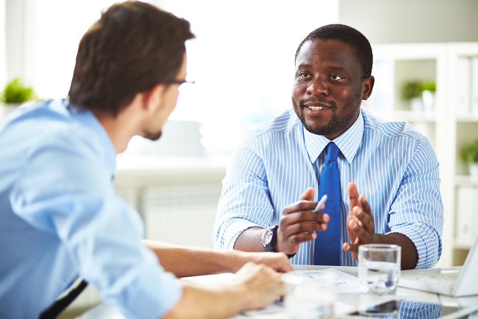 Job candidate waits to answer an interview question from the hiring manager