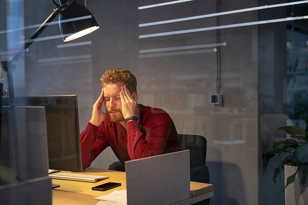 Businessman stresses out over his job responsibilities