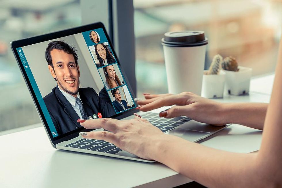 Hiring manager talks to a job applicant during a video call/virtual interview