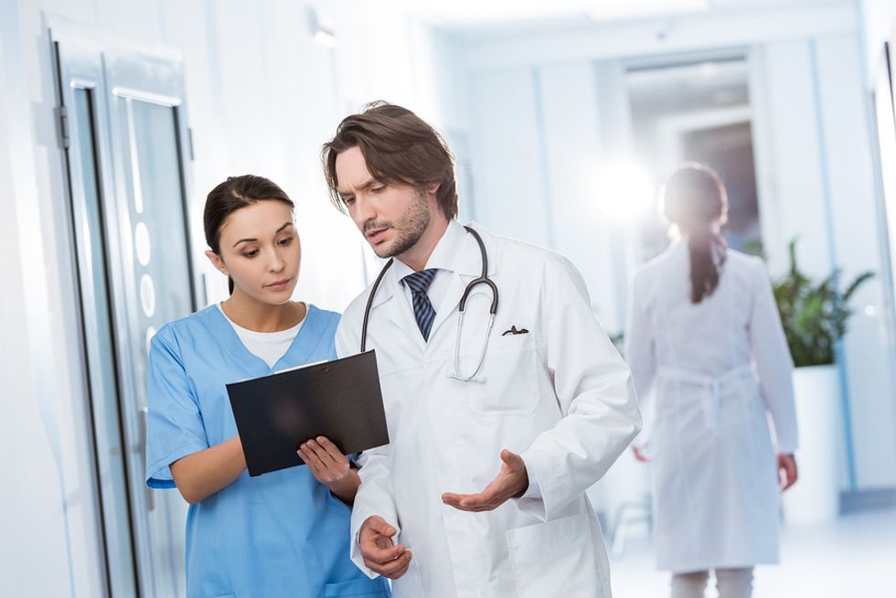 Nurse talks to a doctor at a hospital