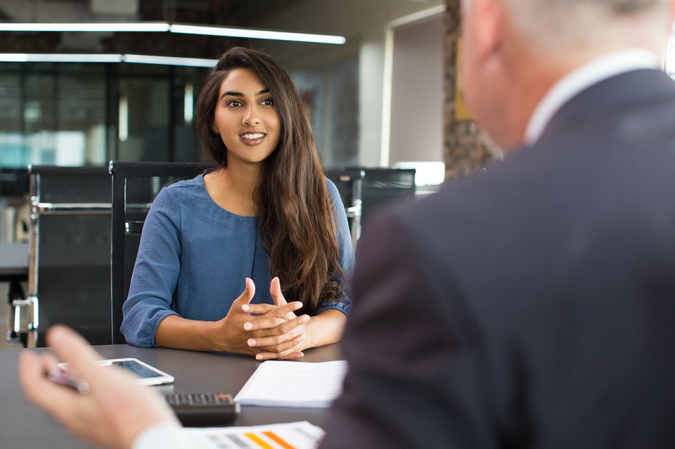 Woman answers the "What is your biggest weakness?" question in a job interview