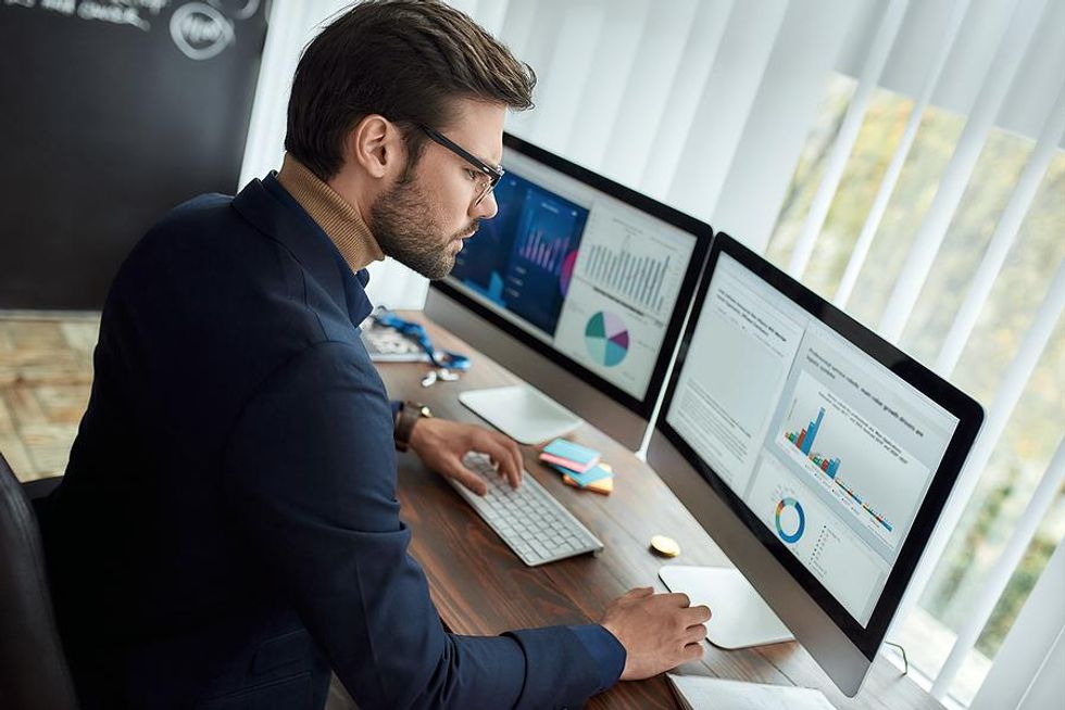 Professional man on computer works hard to be successful