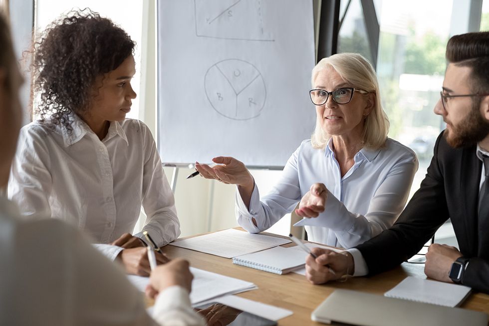 Leader talks about workplace relationships during a work meeting