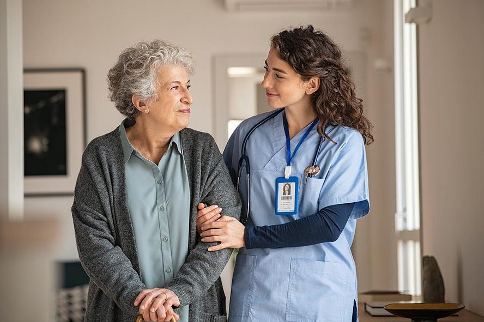 Compassionate medical assistant with a patient