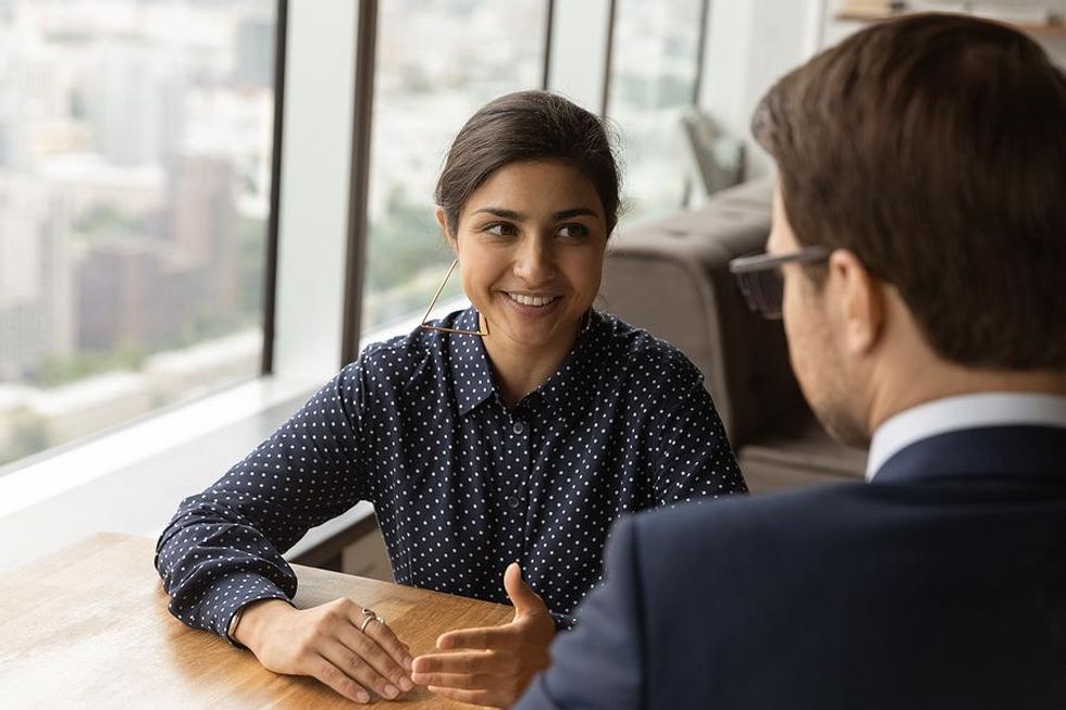 Woman asks a question during an informational interview