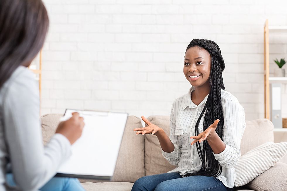 A job seeker shows enthusiasm while answering a question during a job interview