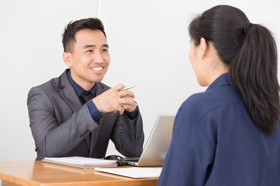 A recruiter/hiring manager has an engaging conversation with a job candidate during an interview