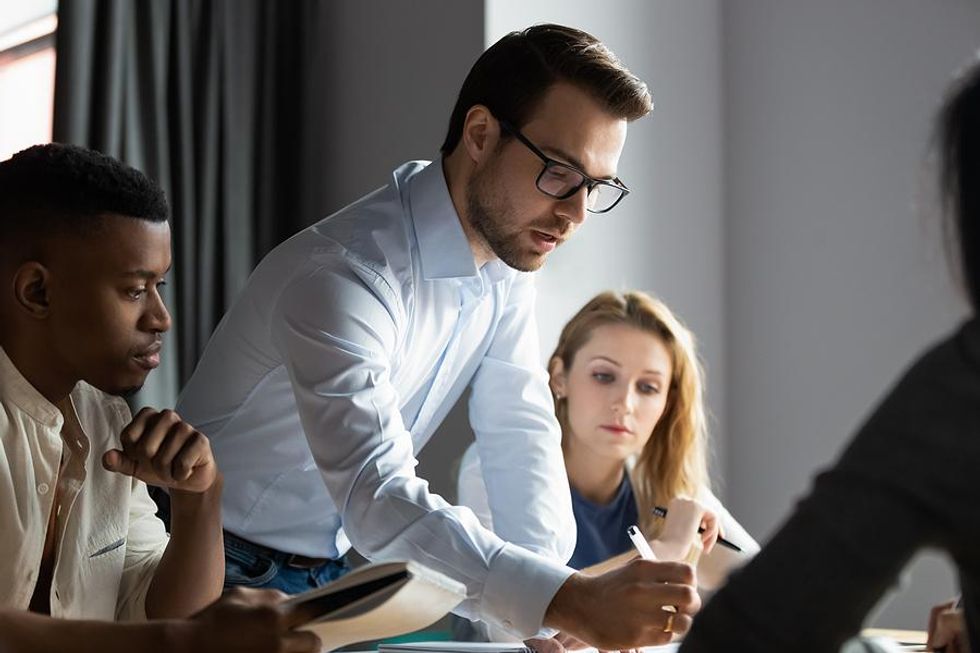 CMO talks to his marketing team during a meeting