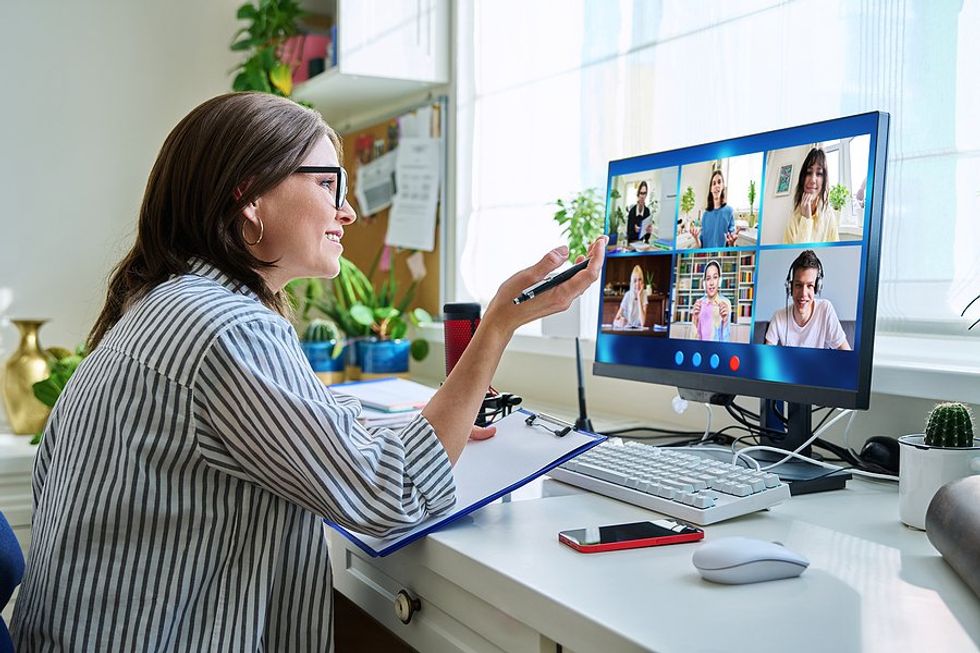 Woman leads a virtual meeting with her coworkers