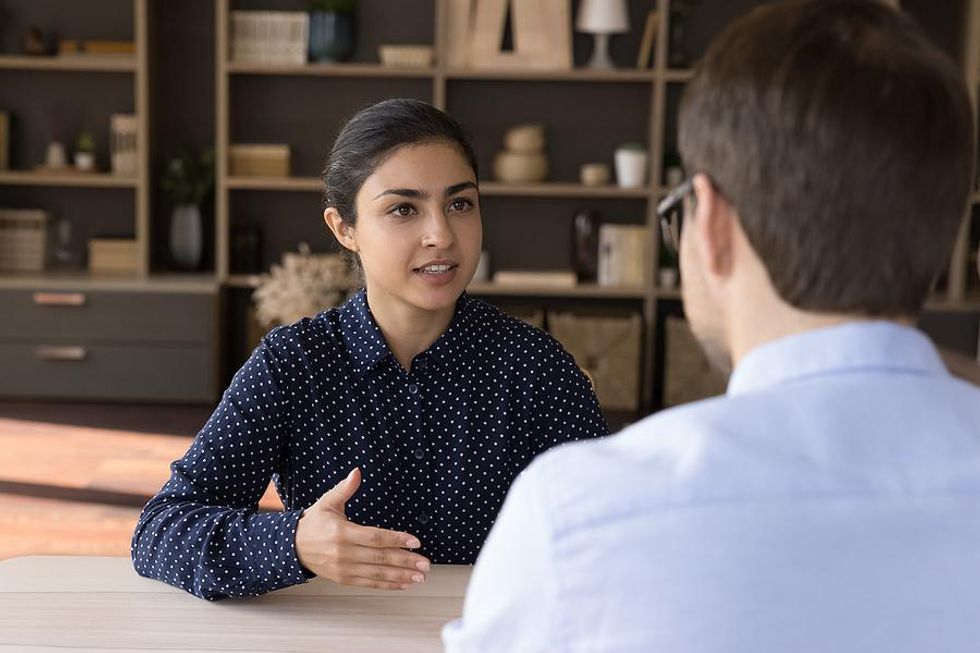 Woman maintains good eye contact during a job interview