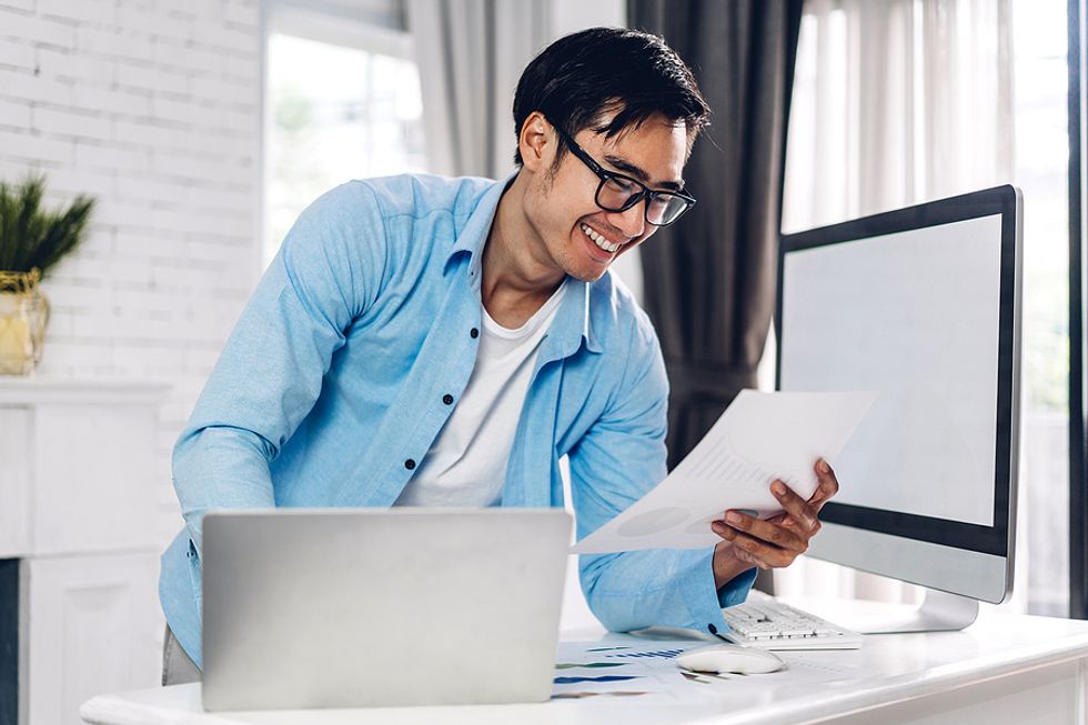 Man on laptop improves his industry knowledge before returning to the workforce