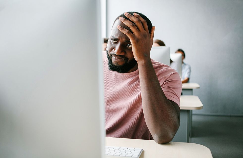 Unhappy man considers quitting his job while he's at work