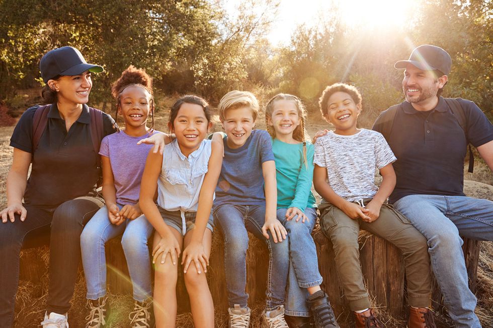 Two teachers work a summer job with kids