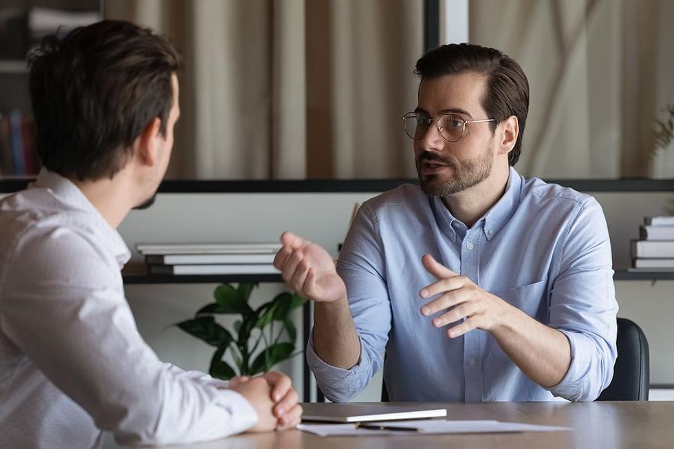 Man answers the interview question, "Why should we hire you?"