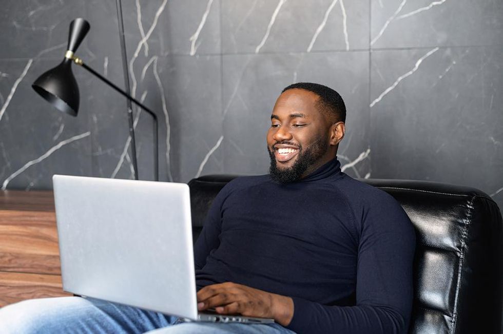 Man on laptop asks some colleagues for LinkedIn recommendations